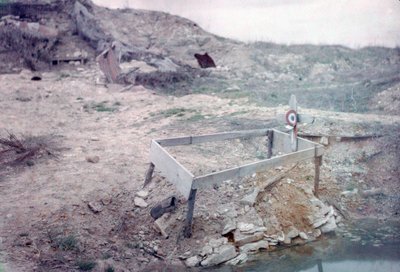 Grave of an Unknown French Soldier with His Gun, Next to a Shell Crater on the Western Front, France, c.1914-18 by French Photographer